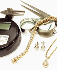 gemstone loupe with diamond studs, necklace and bracelet